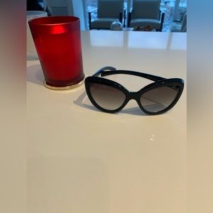 Authentic Prada women’s cat eye sunglasses in black plastic with original case